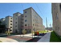 Imagem de apartamento em condomínio residencial com torre próxima