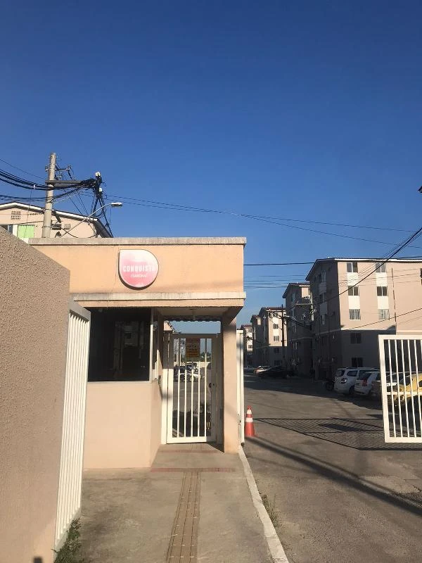 Apartamento no Condomínio Residencial Conquista Itabori com entrada pela guarita e blocos residenciais ao fundo