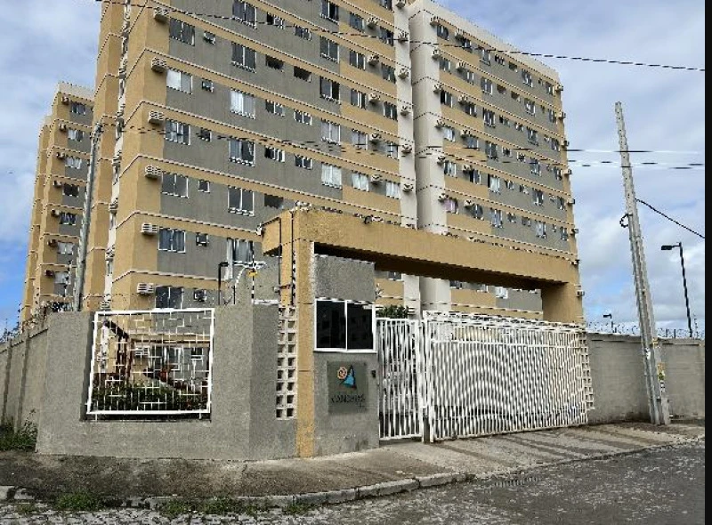 Apartamento bege em condomínio fechado com portaria e múltiplos blocos residenciais visíveis